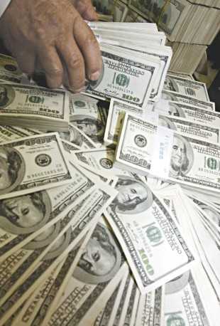 Para este ano, a projeção para o dólar passou de R$ 2,55 para R$ 2,60, informa o Focus FOTO: REUTERS