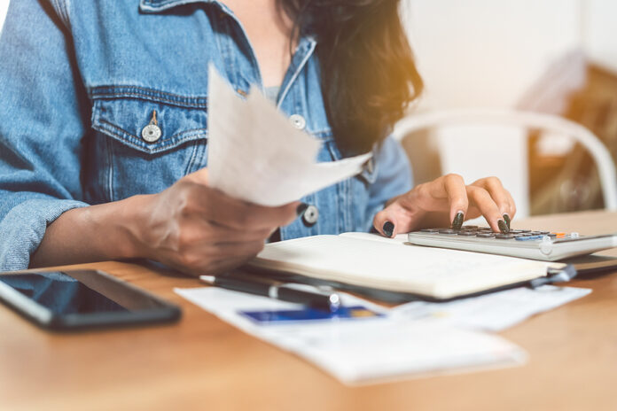 Woman Doing Accounting Home Finance Expenses And Calculate Credi
